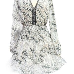 BEBE Dress with plenty smocking on shoulders , sleeves and yoke of the skirt.